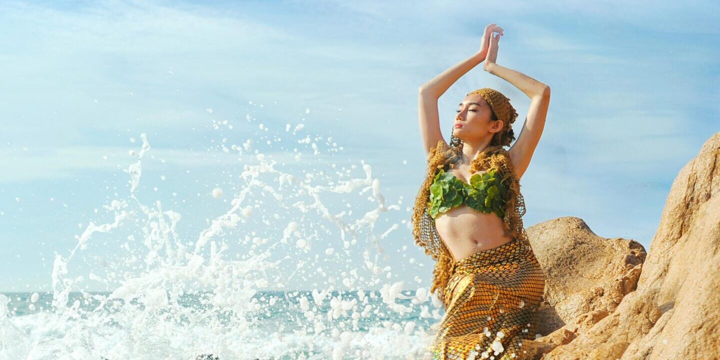 a woman in a garment on a beach